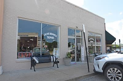 Olive Branch Trophies & More logo – Trophy shop in Olive Branch, MS